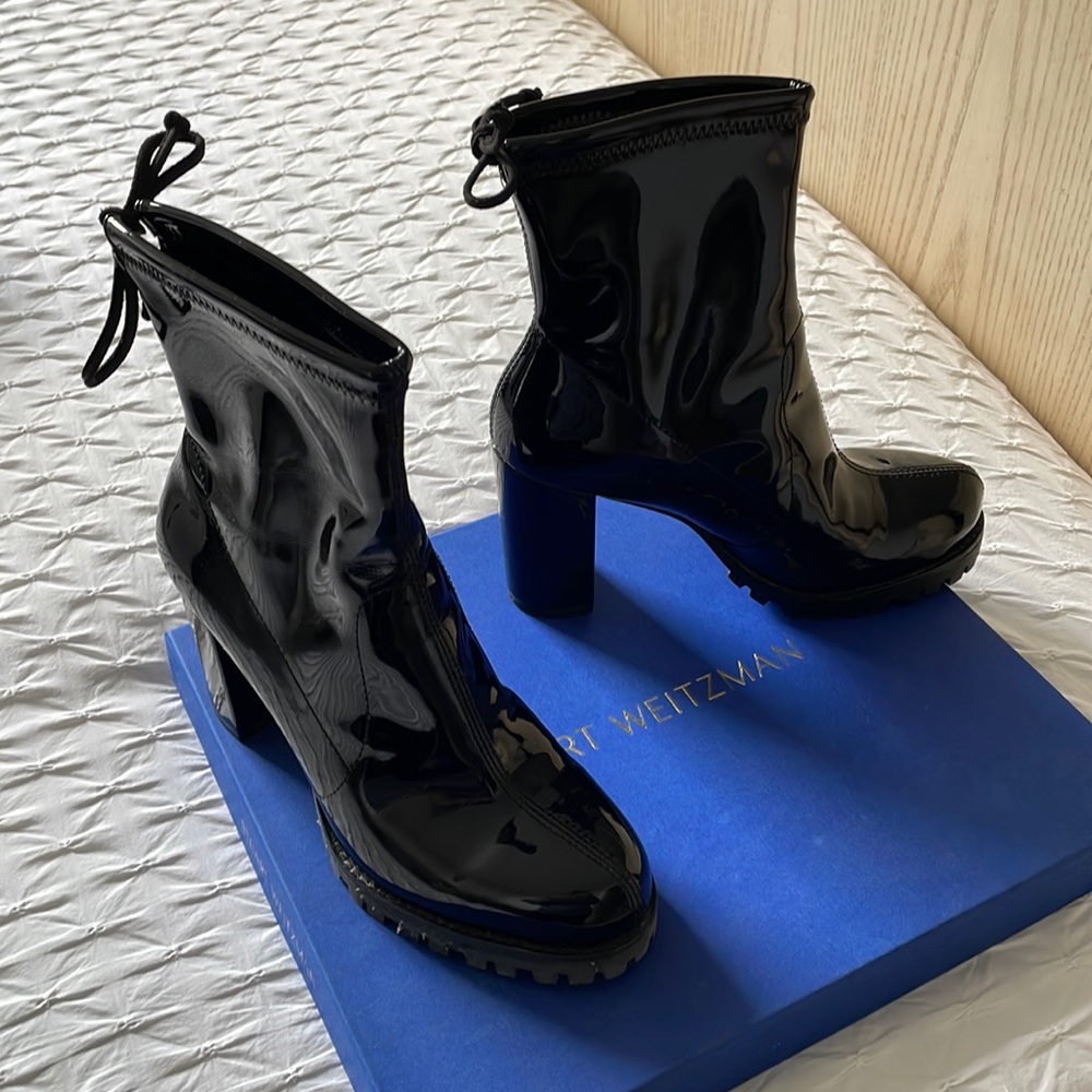 Black Stuart Weitzman vinyl black boots.